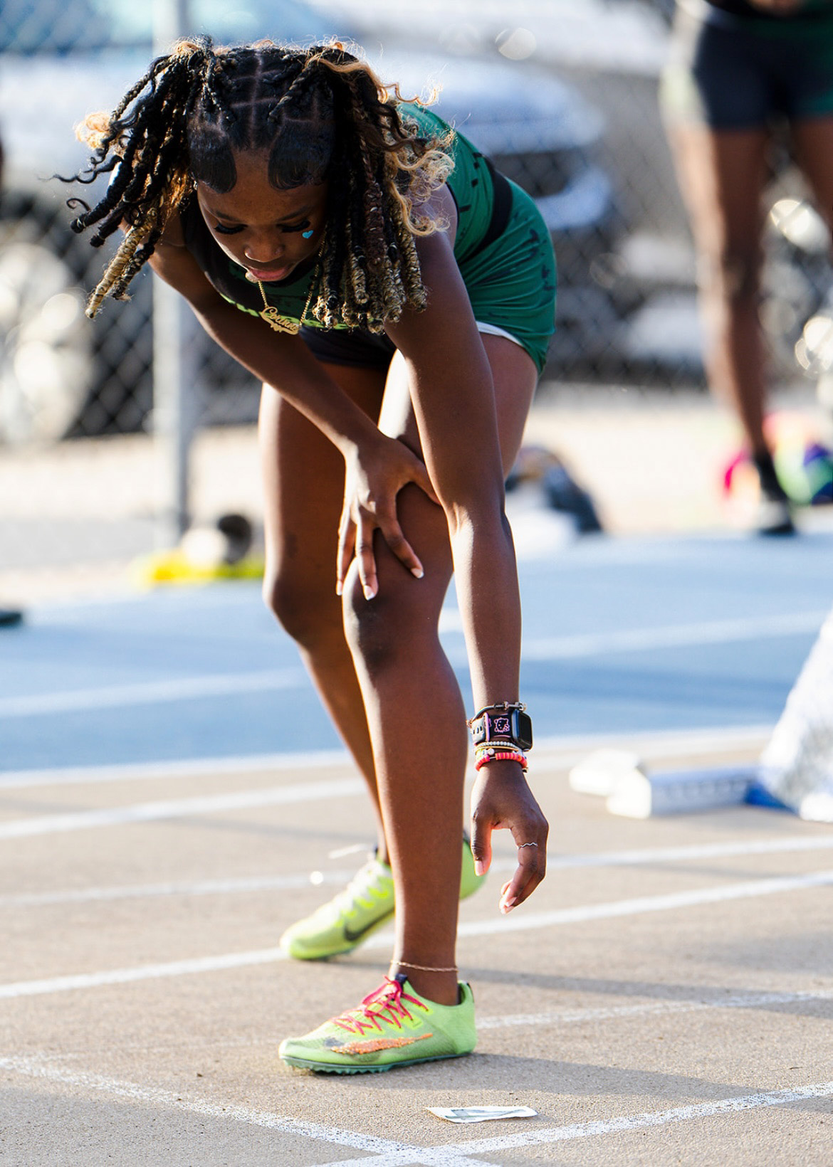 Young female athlete preparing for a race at The Victory Lap 2026 event.