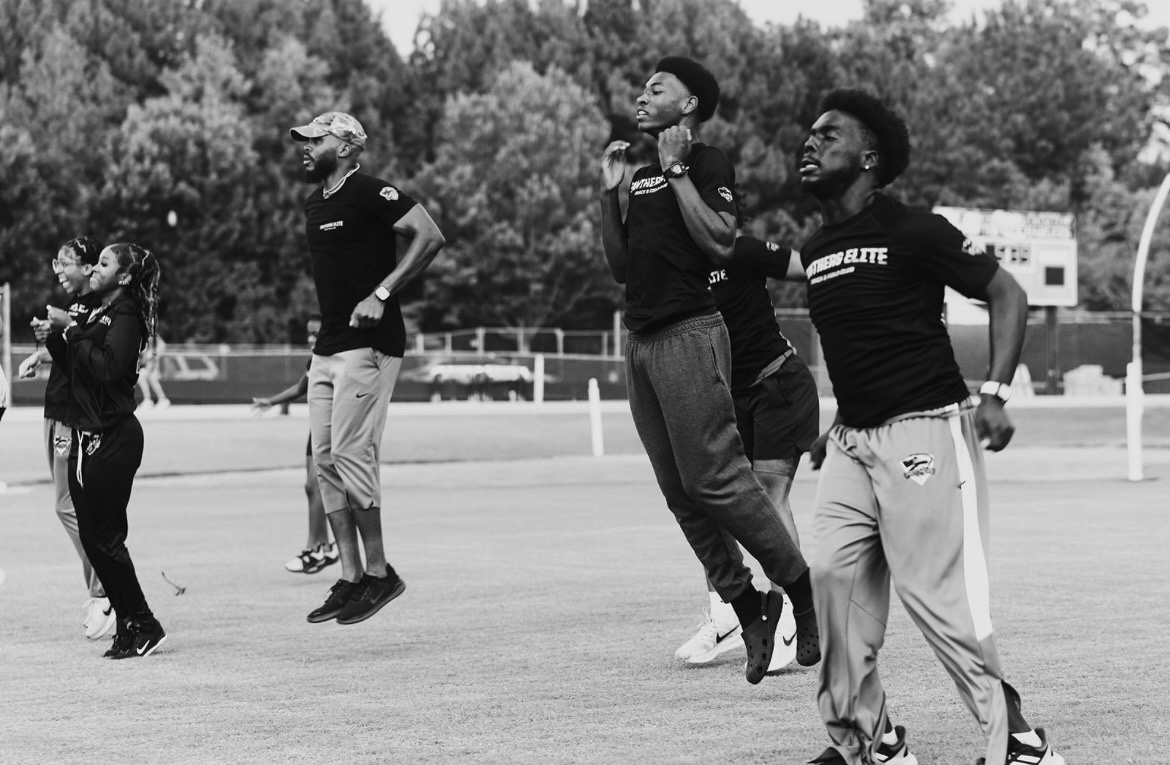Panthers Elite athletes training on the track during a practice session.