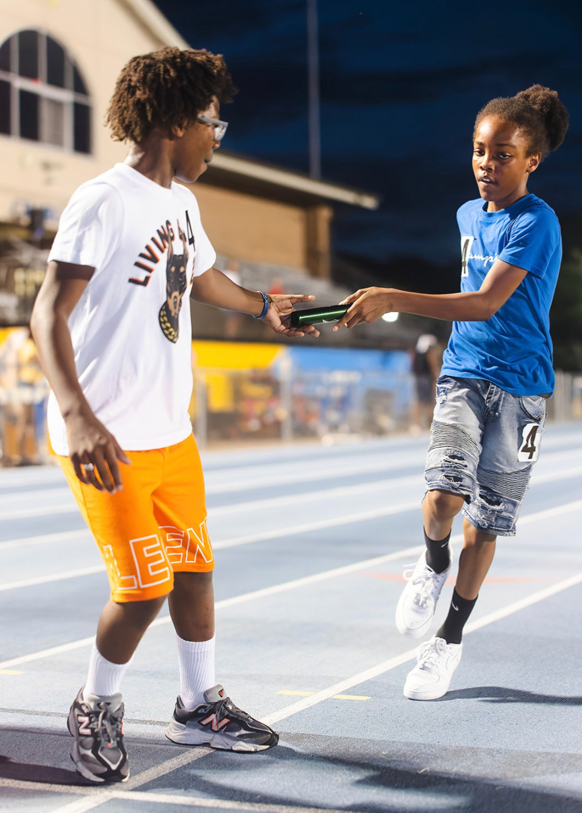 Panthers Elite track athletes exchanging awards at The Victory Lap 2026.