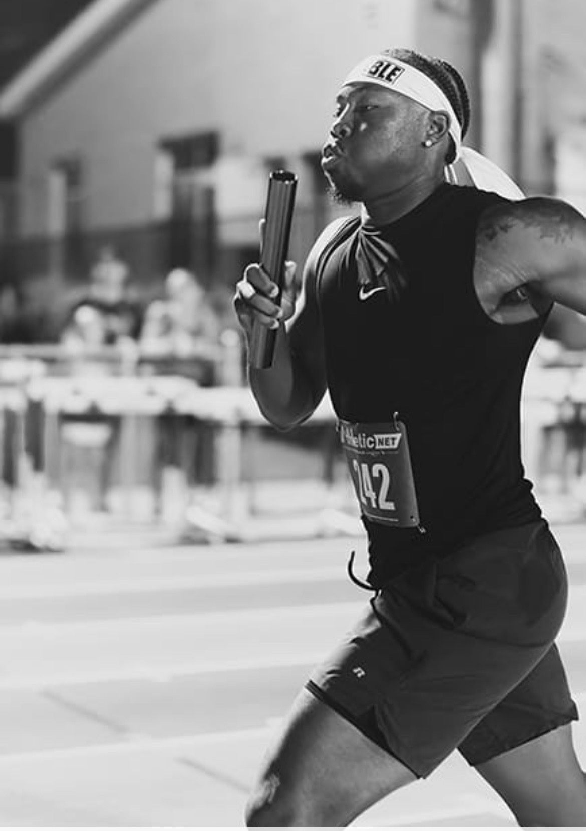 Panthers Elite athlete running with baton at The Victory Lap 2026.