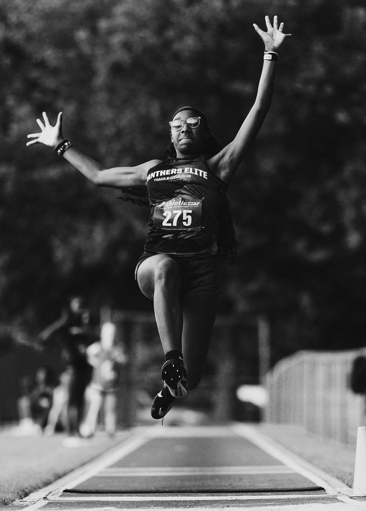 Panthers Elite athlete mid-air during long jump at The Victory Lap 2026.