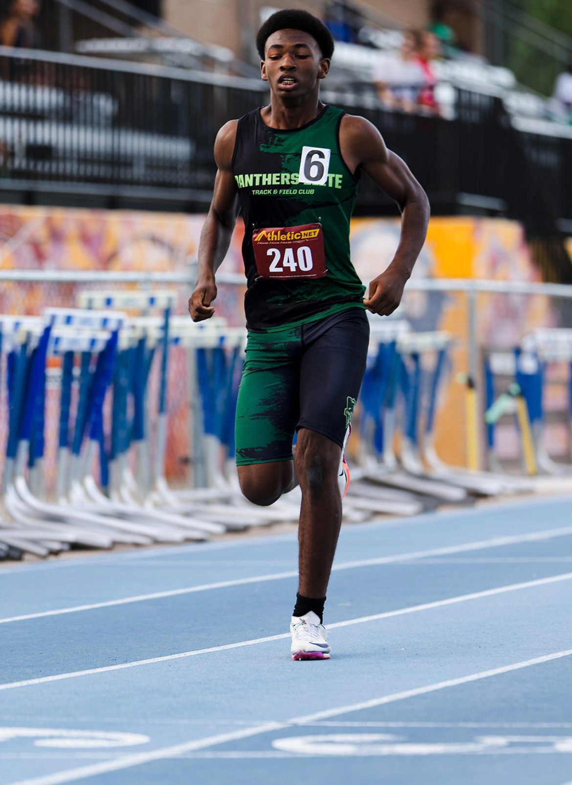 Young male athlete competing in a track race at The Victory Lap 2026.