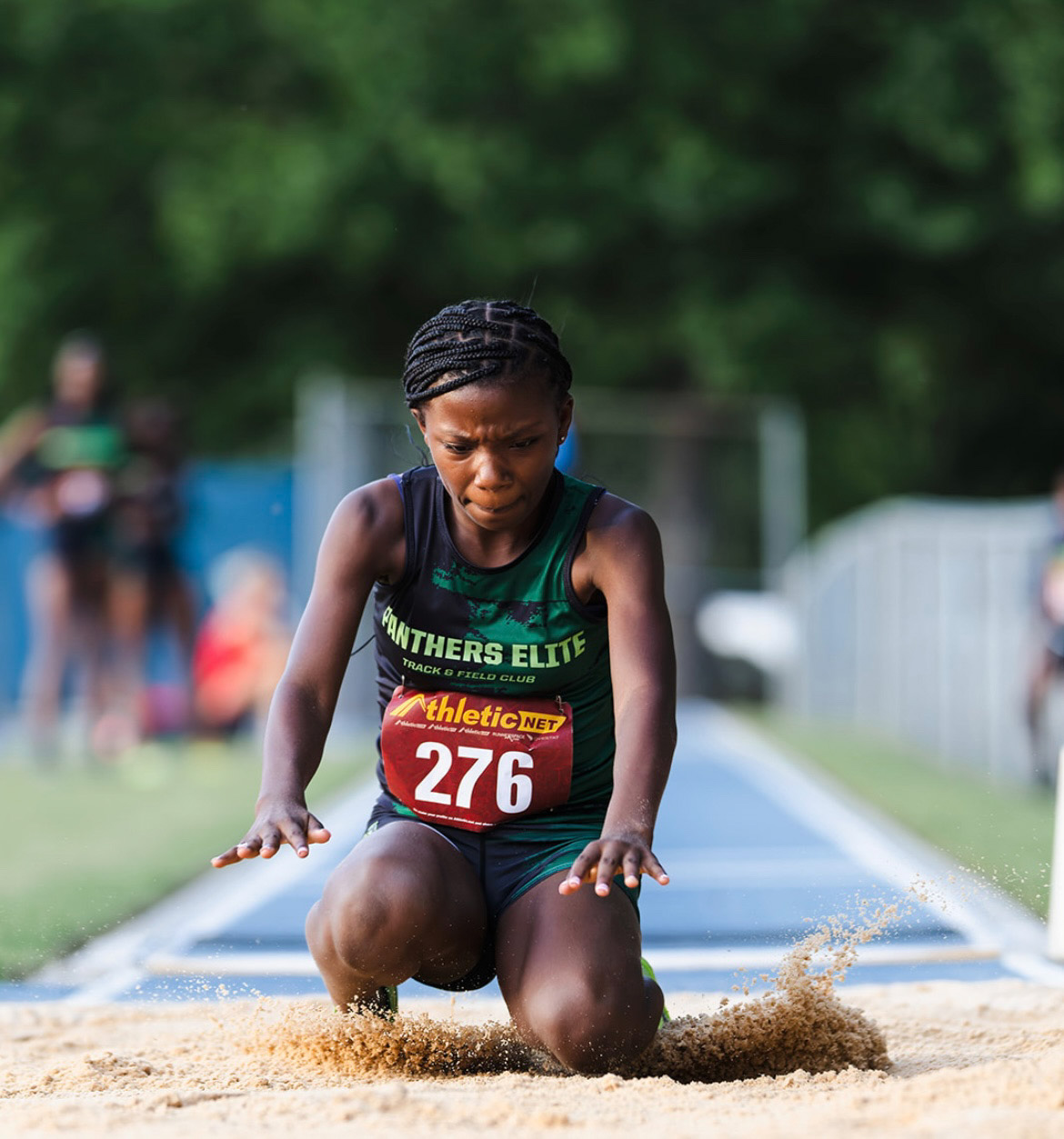 Young athlete from Panthers Elite competing in long jump event.