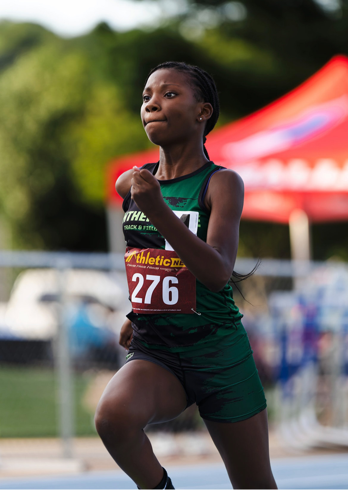 Young female athlete running at The Victory Lap 2026 event.