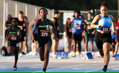 Young athletes competing in a track race at Panthers Elite event.